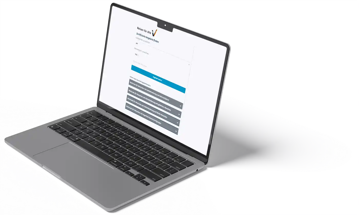 Geöffneter Laptop mit Website „Reisen für Alle“ auf dem Bildschirm.